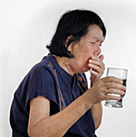 lady choking on a glass of water
