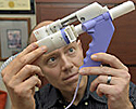 man looking at propane gun