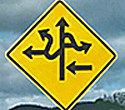 a road sign pointing in five different directions 