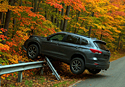 An SUV comes to grief in a pile of trees on one of the Ten Most Dangerous Fall Foliage Drives in America