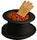 Chili in a top hat with a glove on top